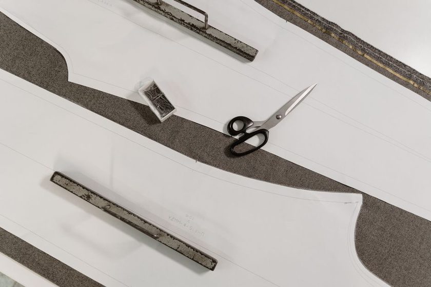 Tape measure laid over a fitted garment on a dress form