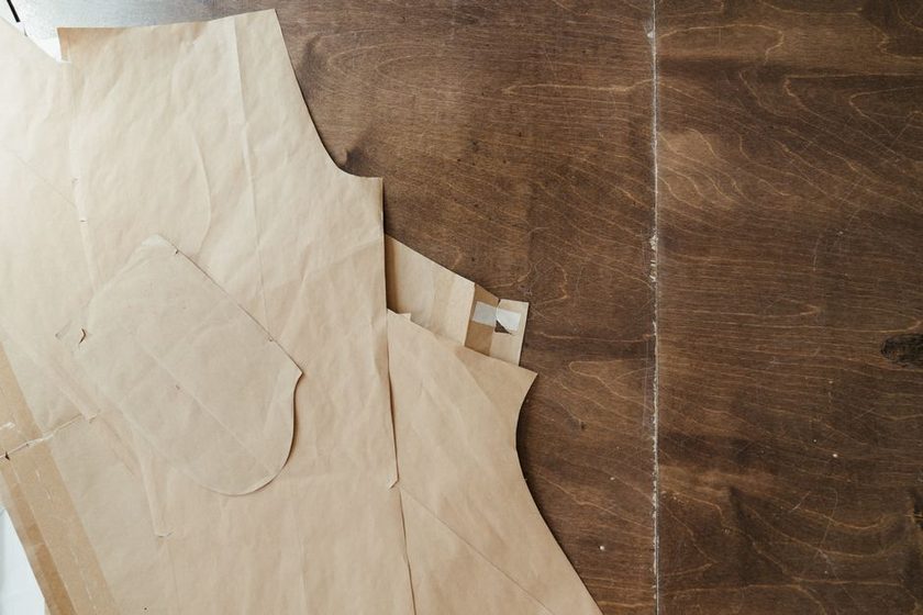 Close-up of notch marks cut into a paper pattern edge