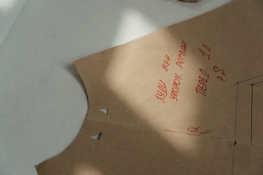 Commercial pattern tissue laid over a personal block on a table
